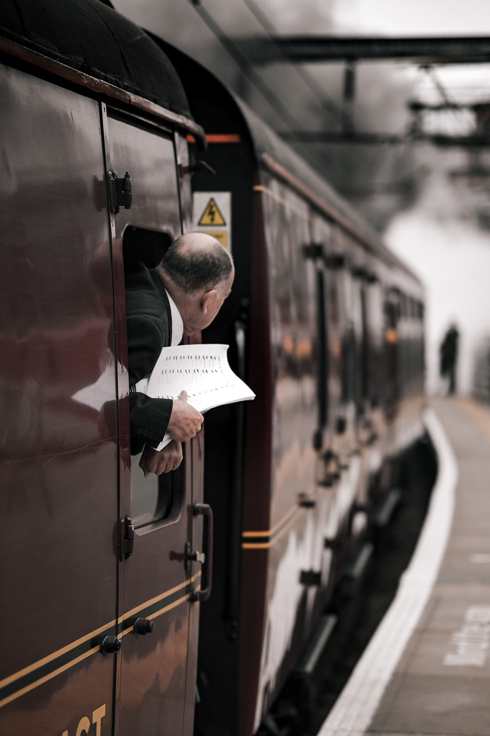 man on train looking for the time